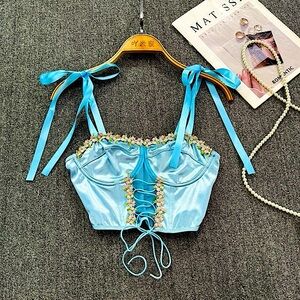 Pastel blue ribbon strap lace up floral crop top